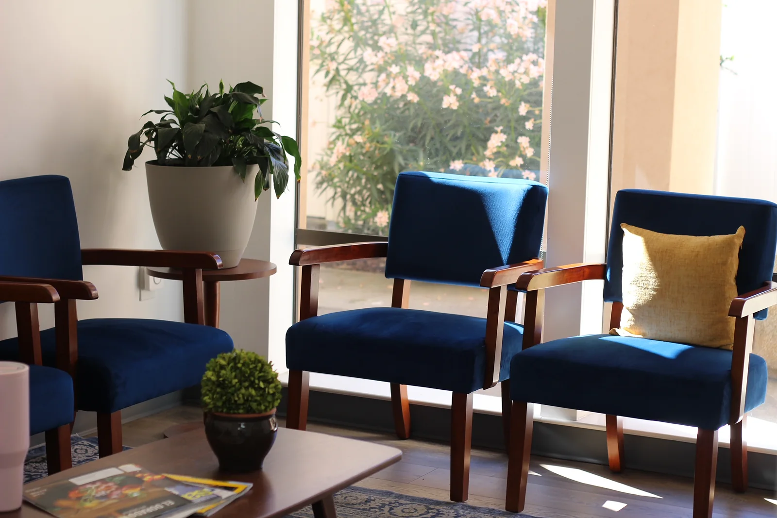 The waiting room, with cushioned chairs and warm lighting